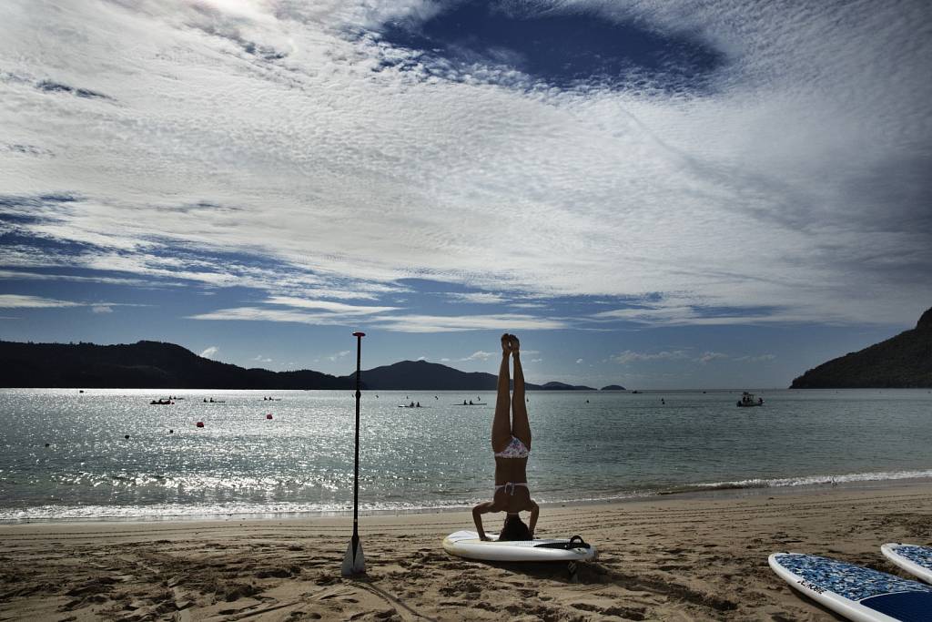 Charlotte Piho demonstrates SUPYoga on Hamilton Island